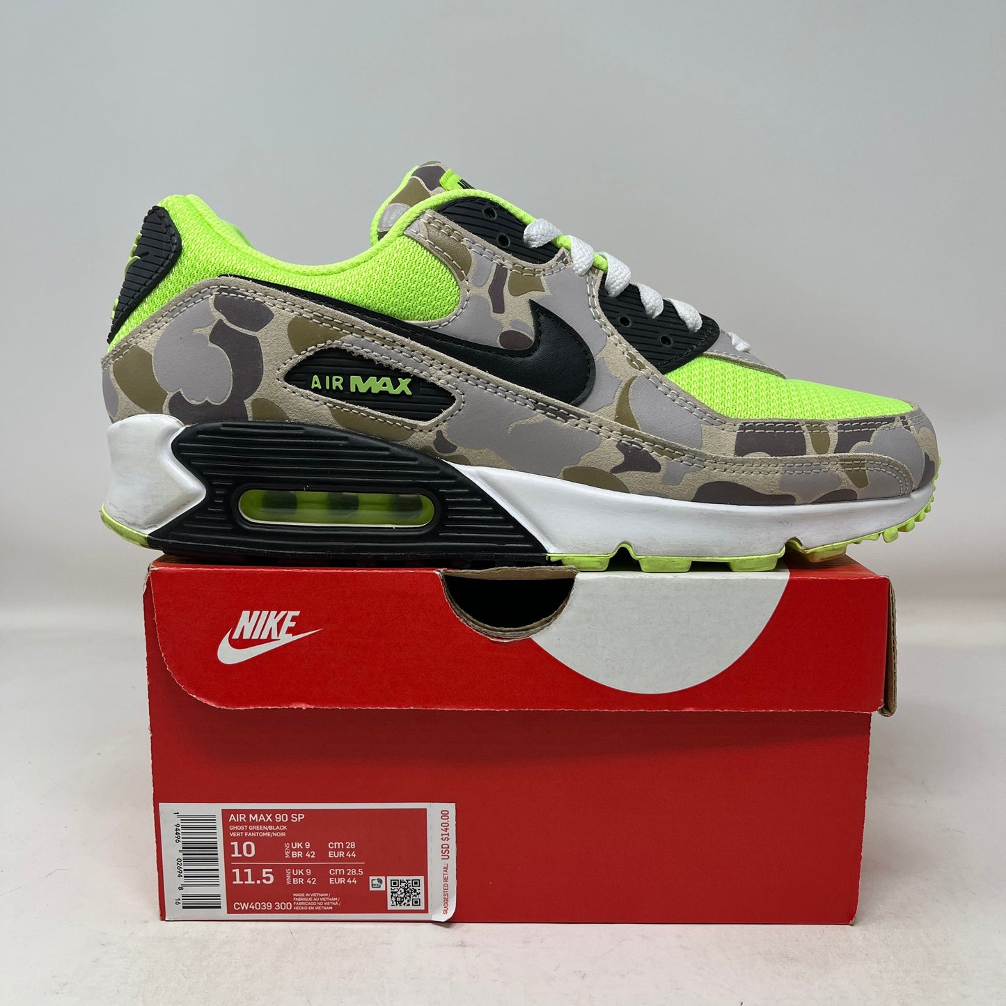 Nike Air Max 90 green camo used sneaker on red Nike box with neon green and black accents