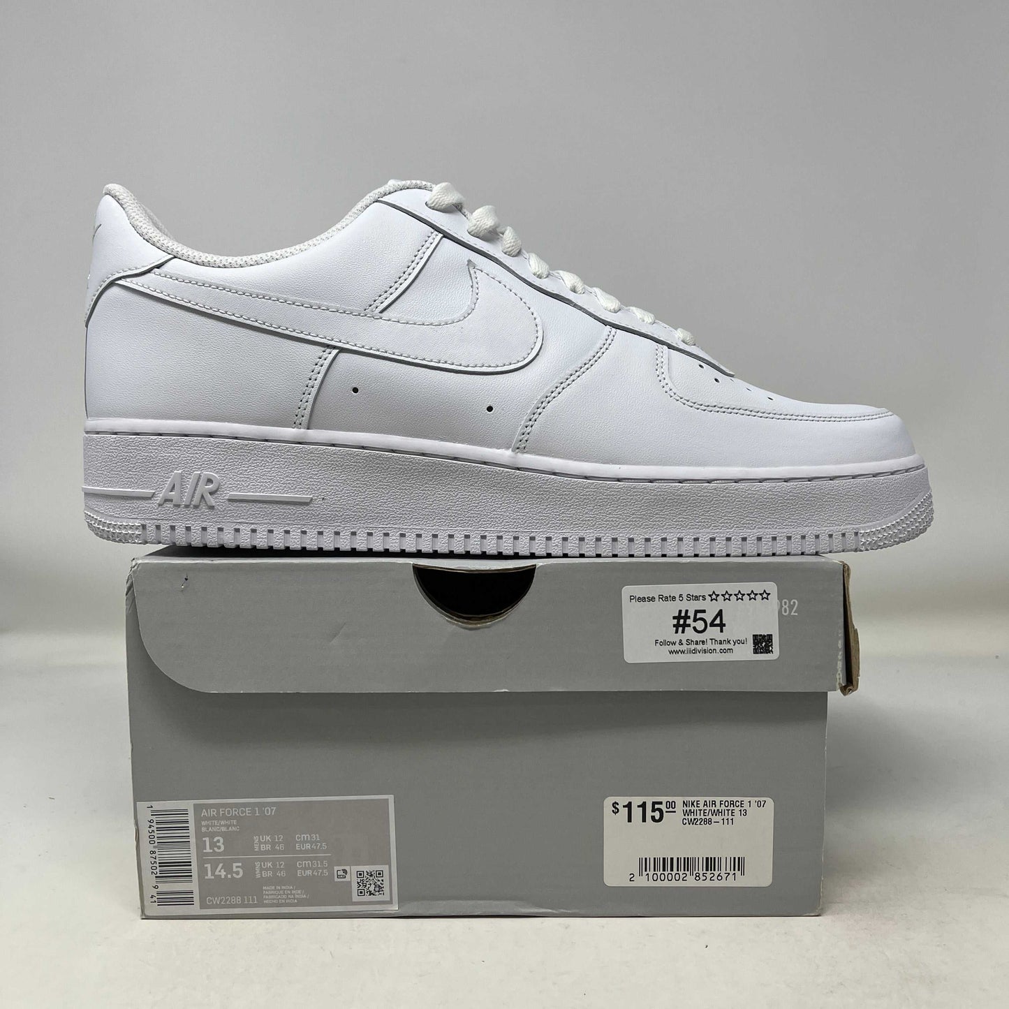 White Nike Air Force 1 Low '07 sneaker on gray shoebox with price tag