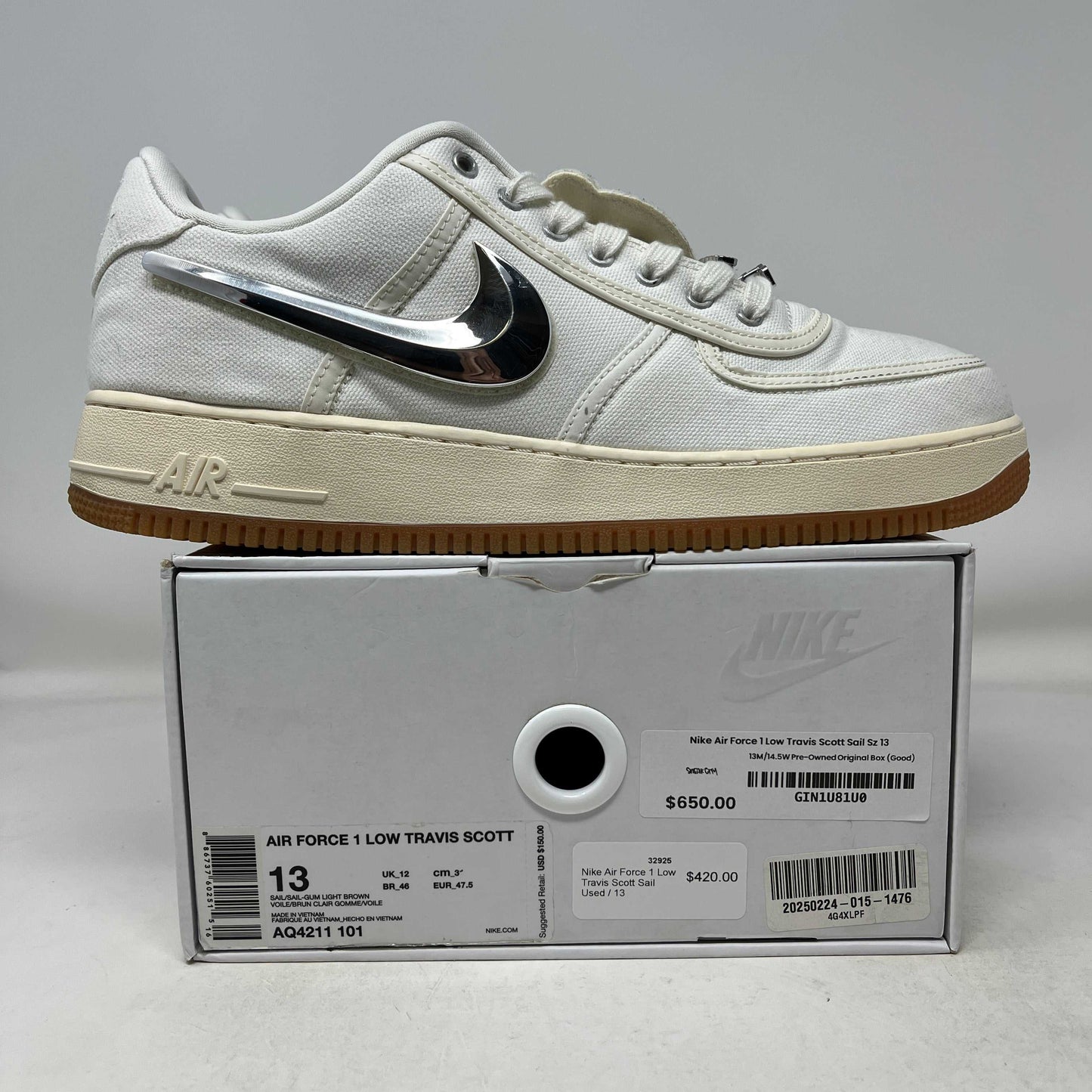 Nike Air Force 1 Low Travis Scott Sail used sneaker with metallic swoosh on box showing size 13 and price tags