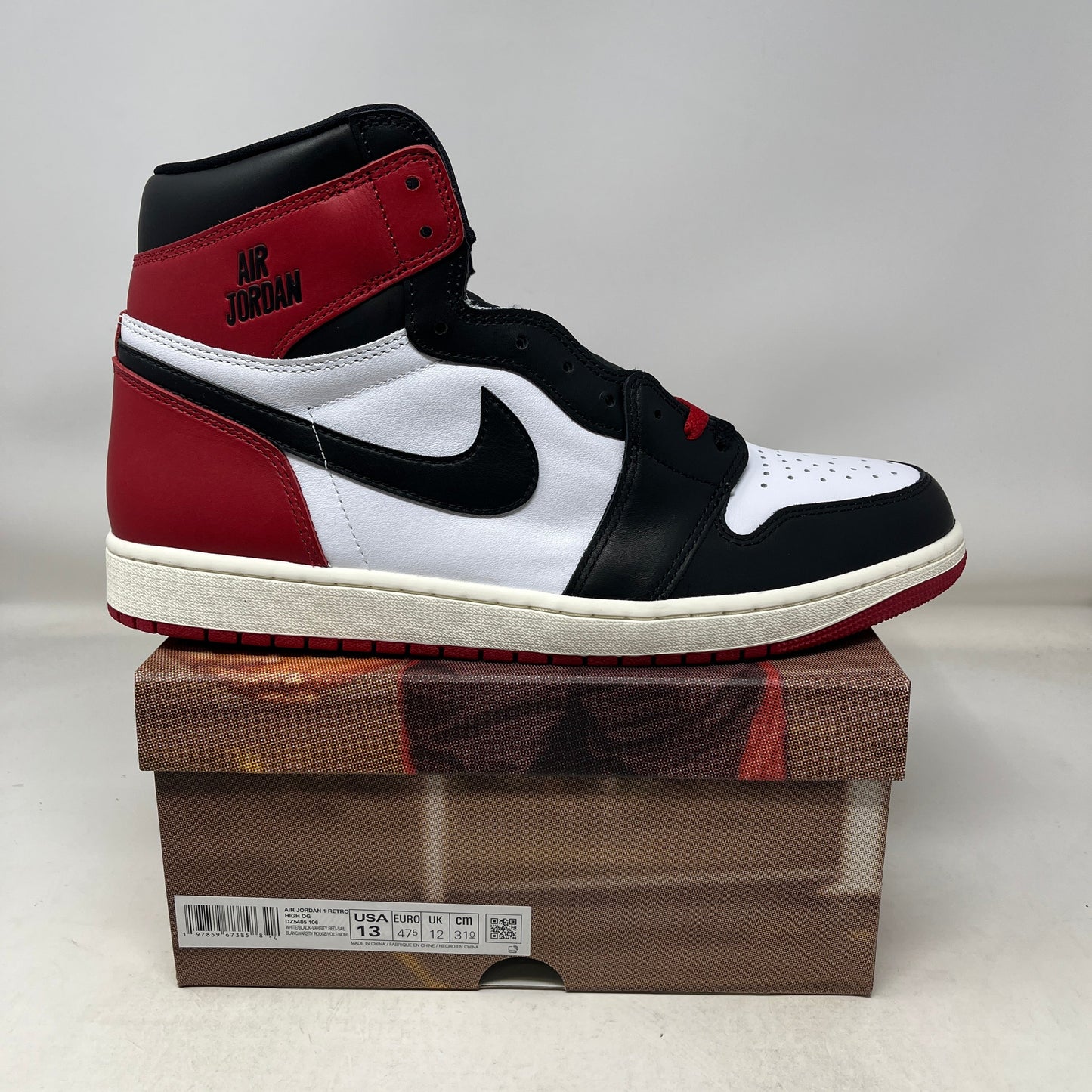 Jordan 1 Retro High OG Black Toe sneaker on box, new condition