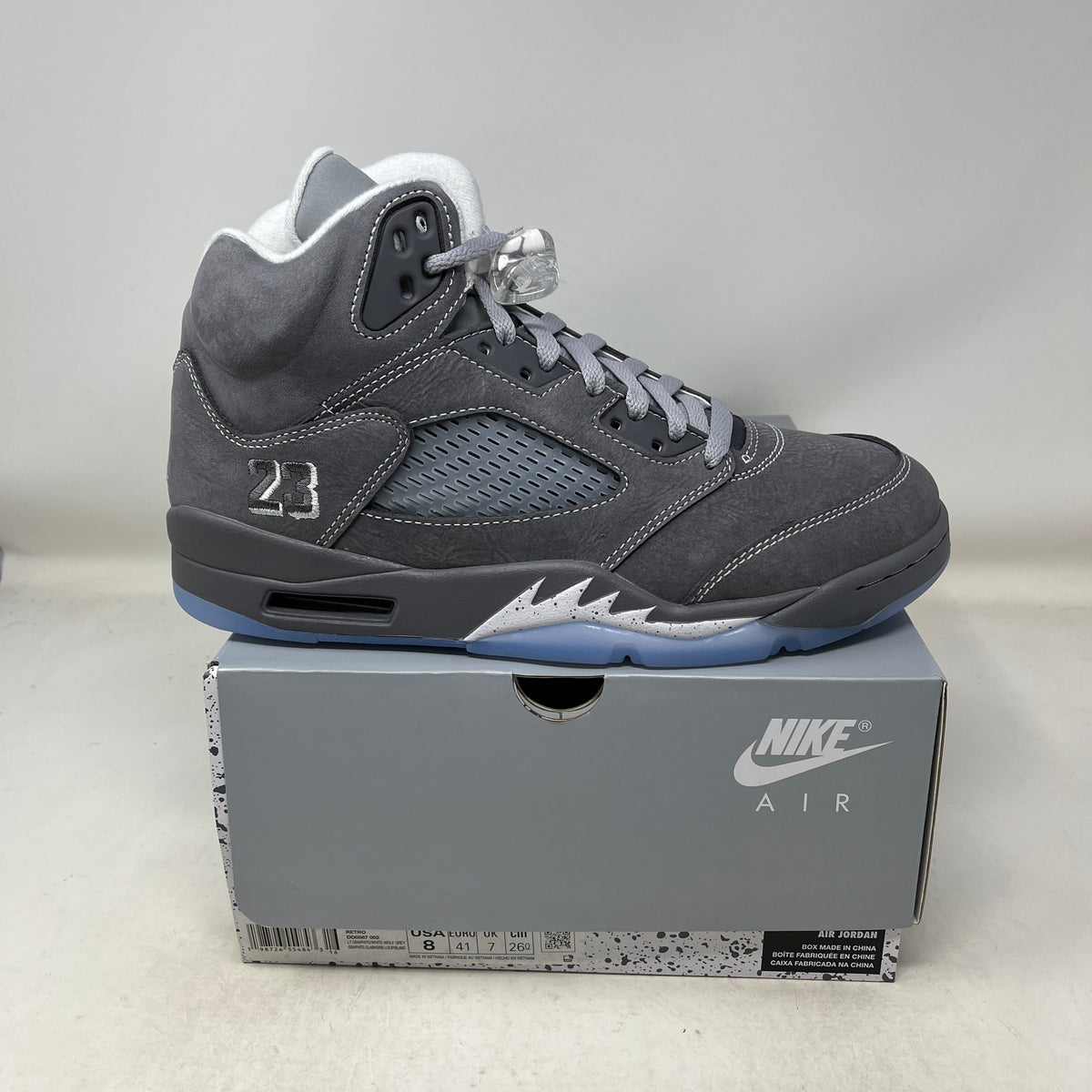 Air Jordan 5 sneaker in wolf grey suede with perforated panels, icy blue outsole, and reflective 3M tongue; Jordan 5 Retro Wolf Grey