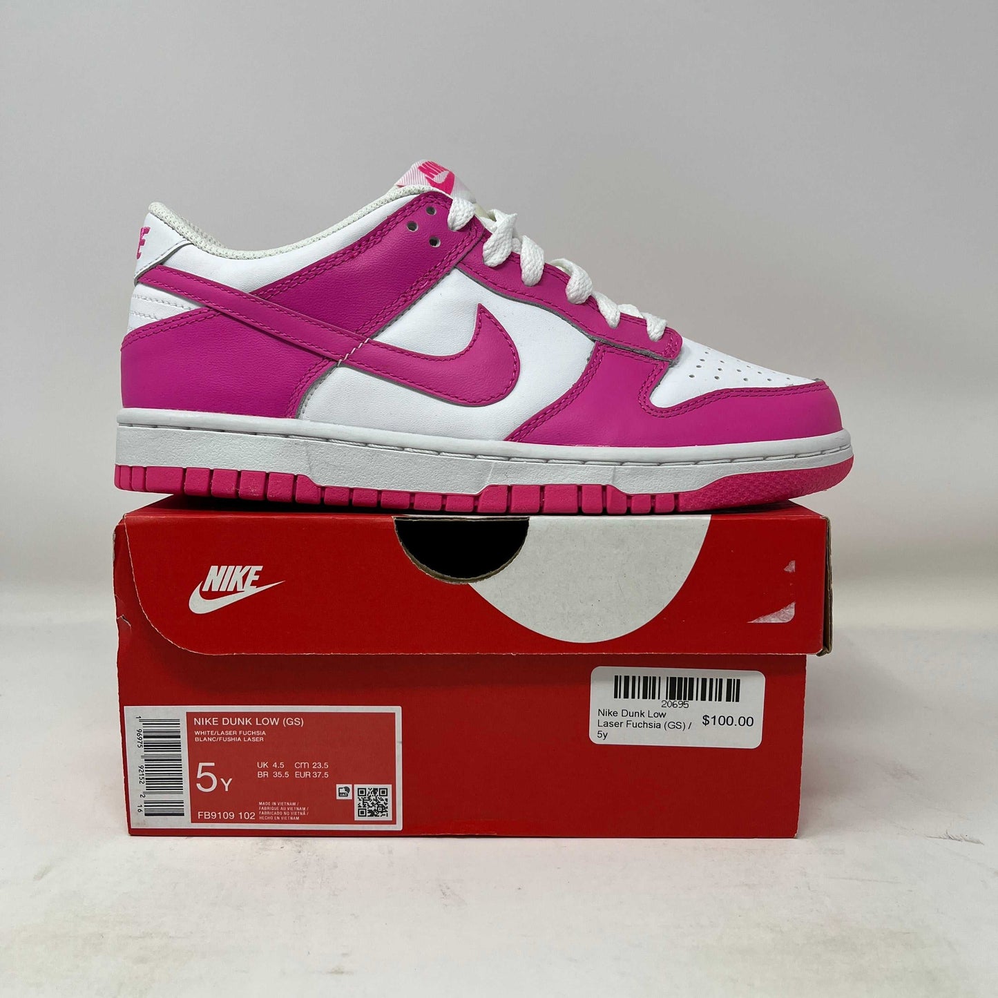 Nike Dunk Low Laser Fuchsia GS sneaker on red Nike box white and pink colorway