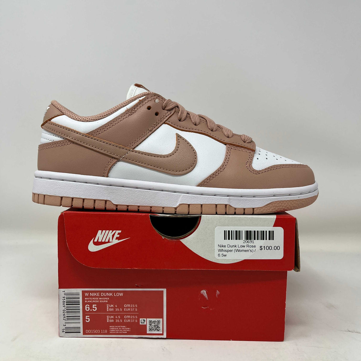 Dunk low Rose Whisper sneaker with a white leather base, rose-brown overlays and Swoosh, and a gum sole.