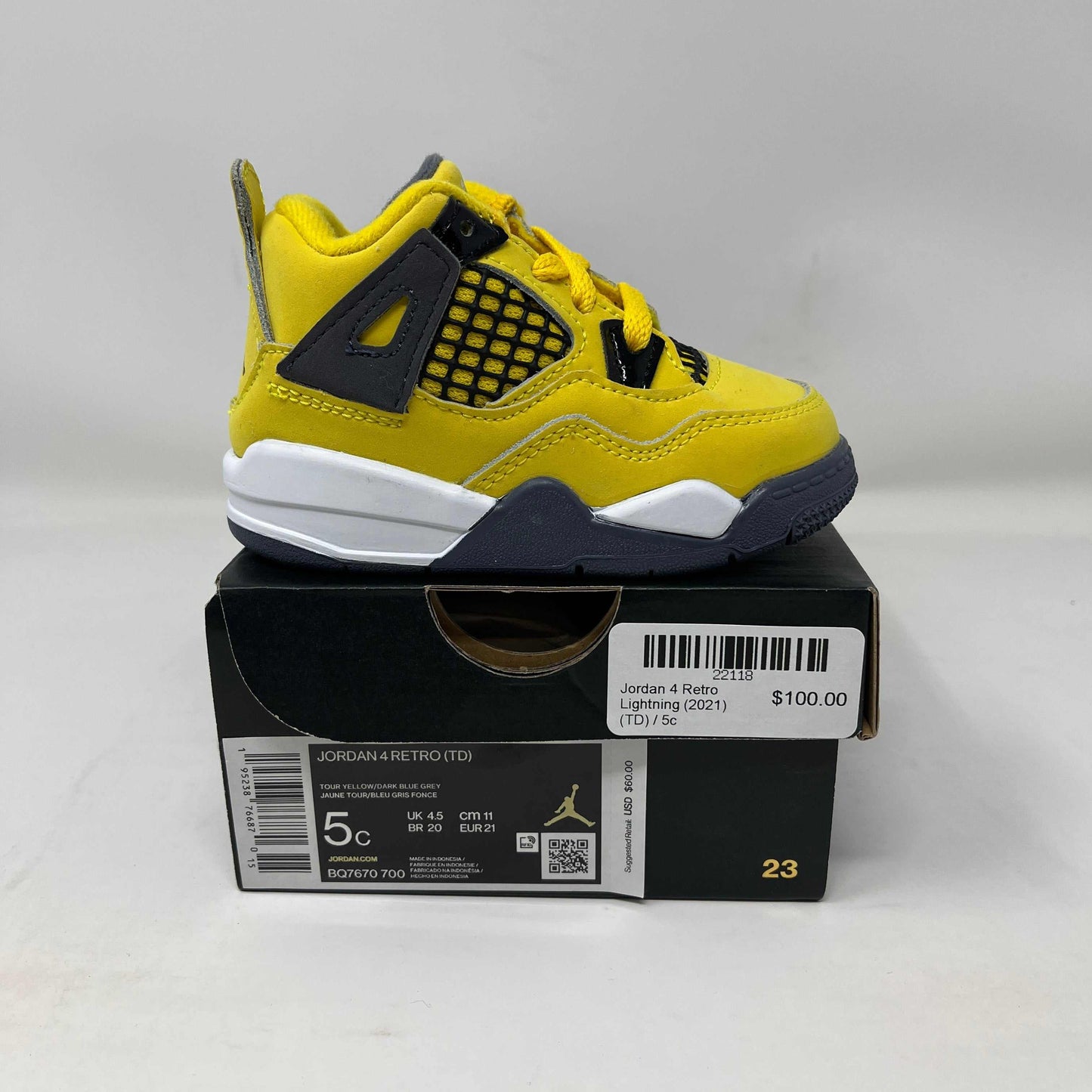 Toddler Jordan 4 Retro Lightning 2021 yellow and black sneaker on box