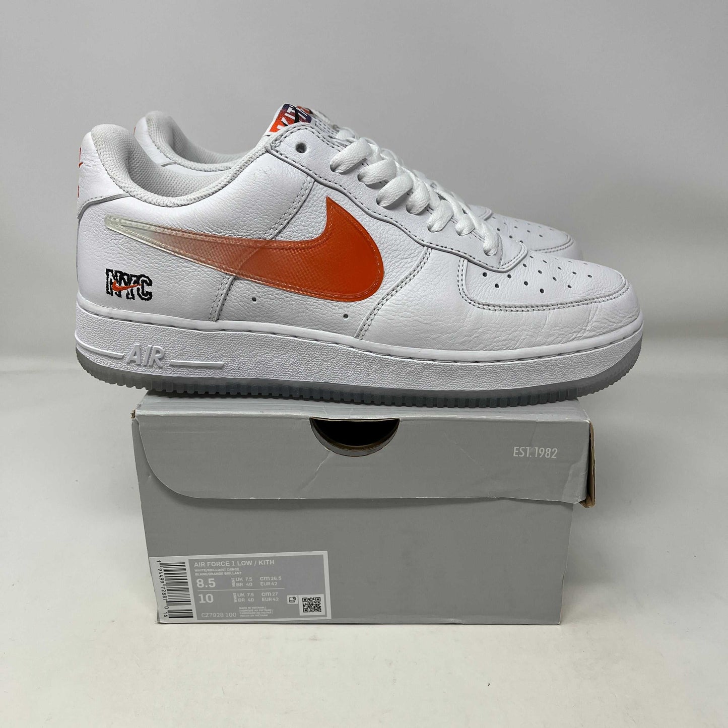 Used Nike Air Force 1 Low Kith Knicks Home sneakers with white leather and orange swoosh on box