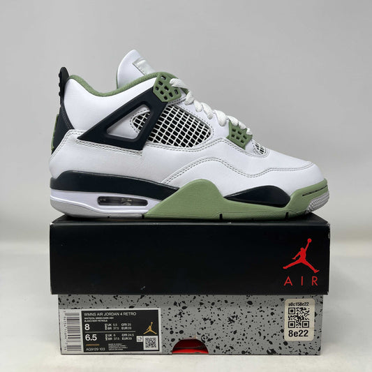 Jordan 4 Retro Seafoam women's sneaker in white and green on top of branded Air Jordan box