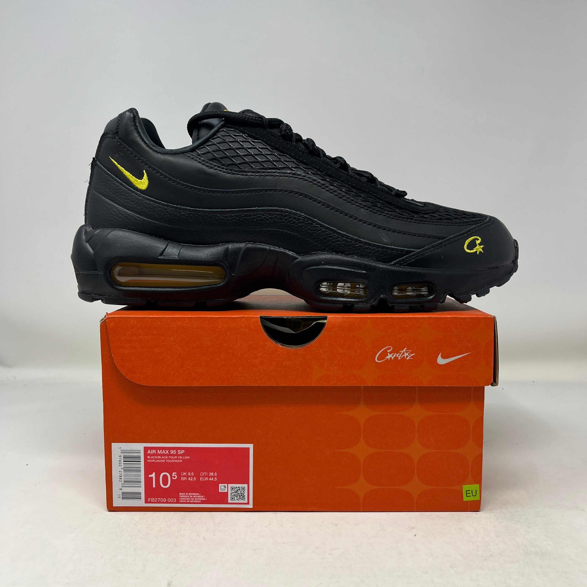 Nike Air Max 95 Corteiz Honey Black sneaker on orange Nike box, new and original design