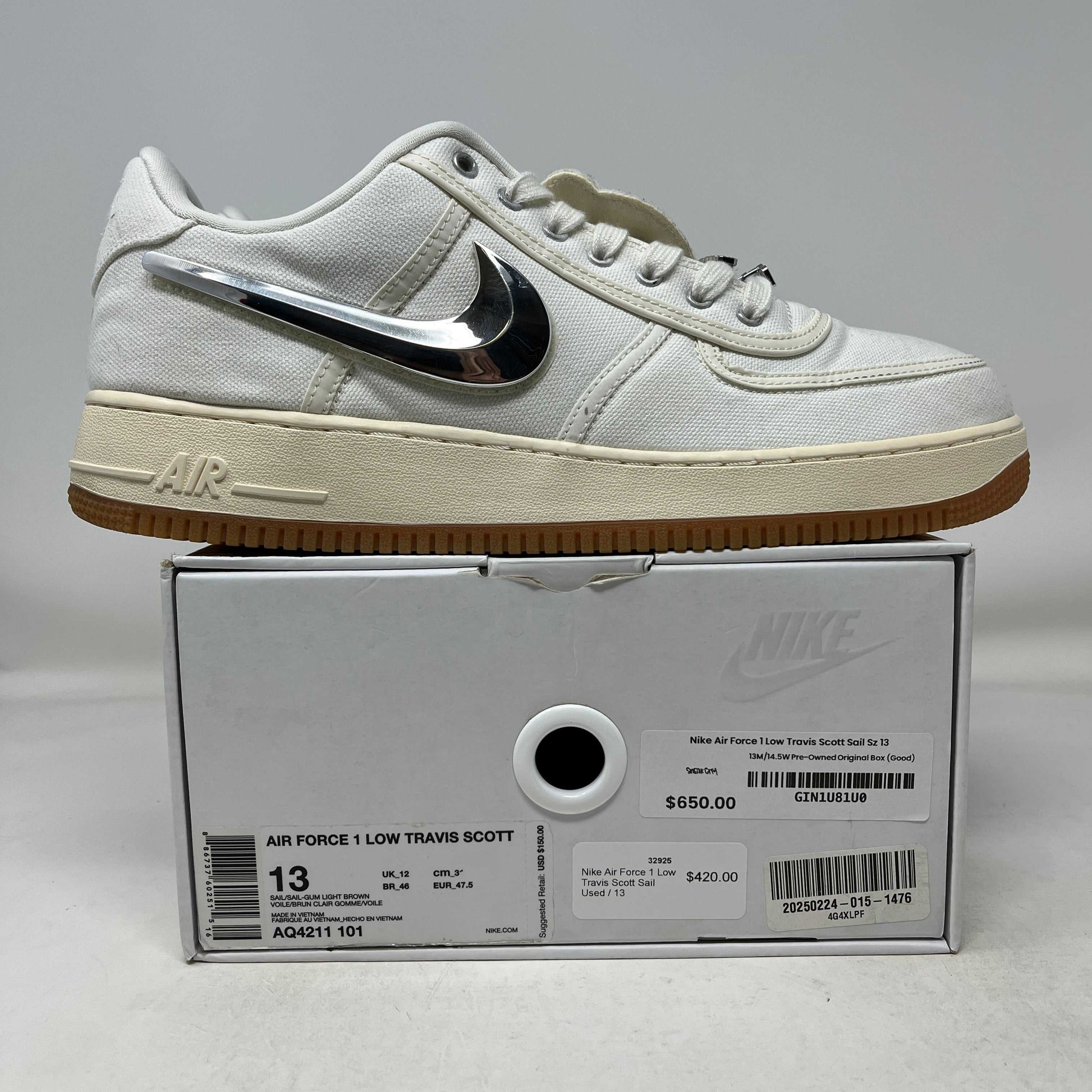 Nike Air Force 1 Low Travis Scott Sail used sneaker with metallic swoosh on box showing size 13 and price tags