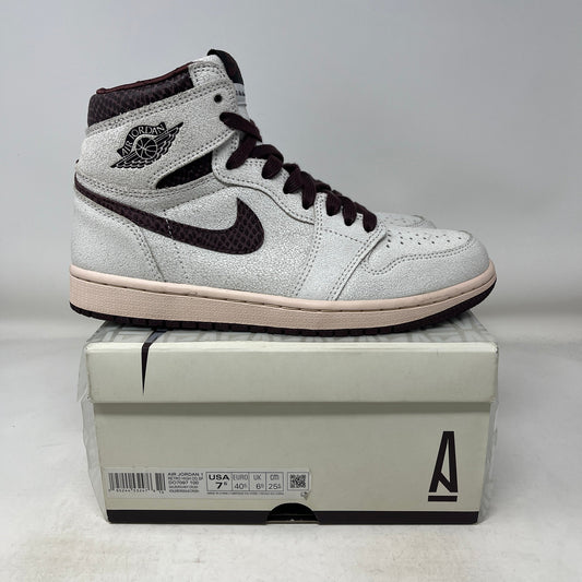 Used Jordan 1 Retro High OG A Ma Maniére sneaker in white and dark brown on a shoebox