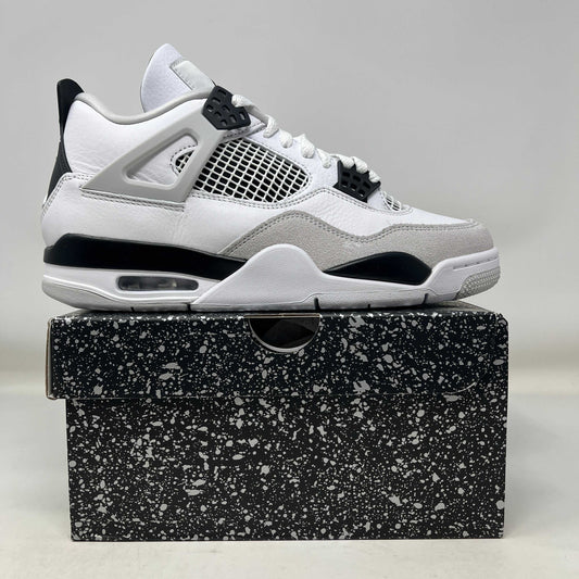 Jordan 4 Retro Military Black sneaker in white, black, and grey on black speckled shoebox