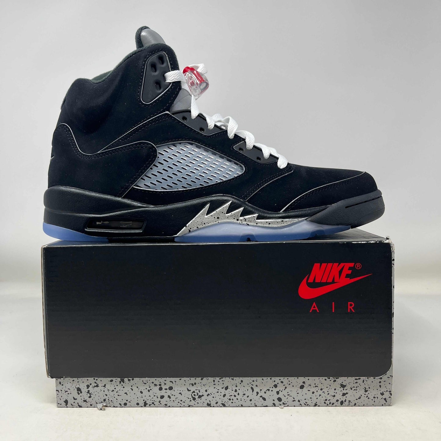 Jordan 5 Retro OG Black Metallic sneaker on Nike Air box with black and metallic accents