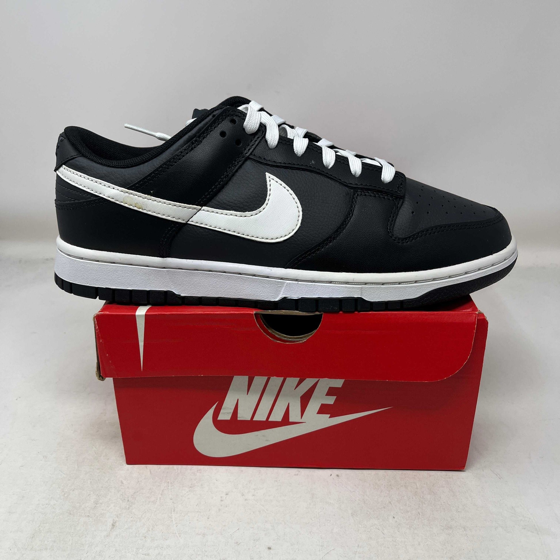 Nike Dunk Low Black White 2022 men's size 10.5 new sneaker with classic black and white leather upper and iconic Swoosh