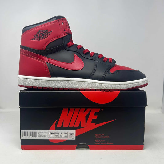 Jordan 1 Retro High '85 OG Bred sneaker in black and red leather, with a high-top silhouette and contrasting Swoosh.