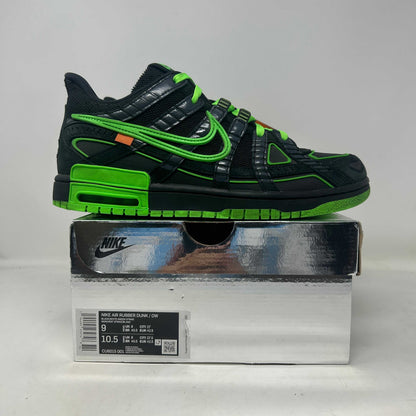 Nike Air Rubber Dunk sneaker in black leather with vivid neon green accents, layered overlays, and bold Swoosh detailing.