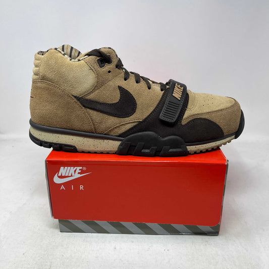 Nike Air Trainer 1 high-top sneaker in tan suede with dark brown overlays, black Swoosh, strap and rugged outsole