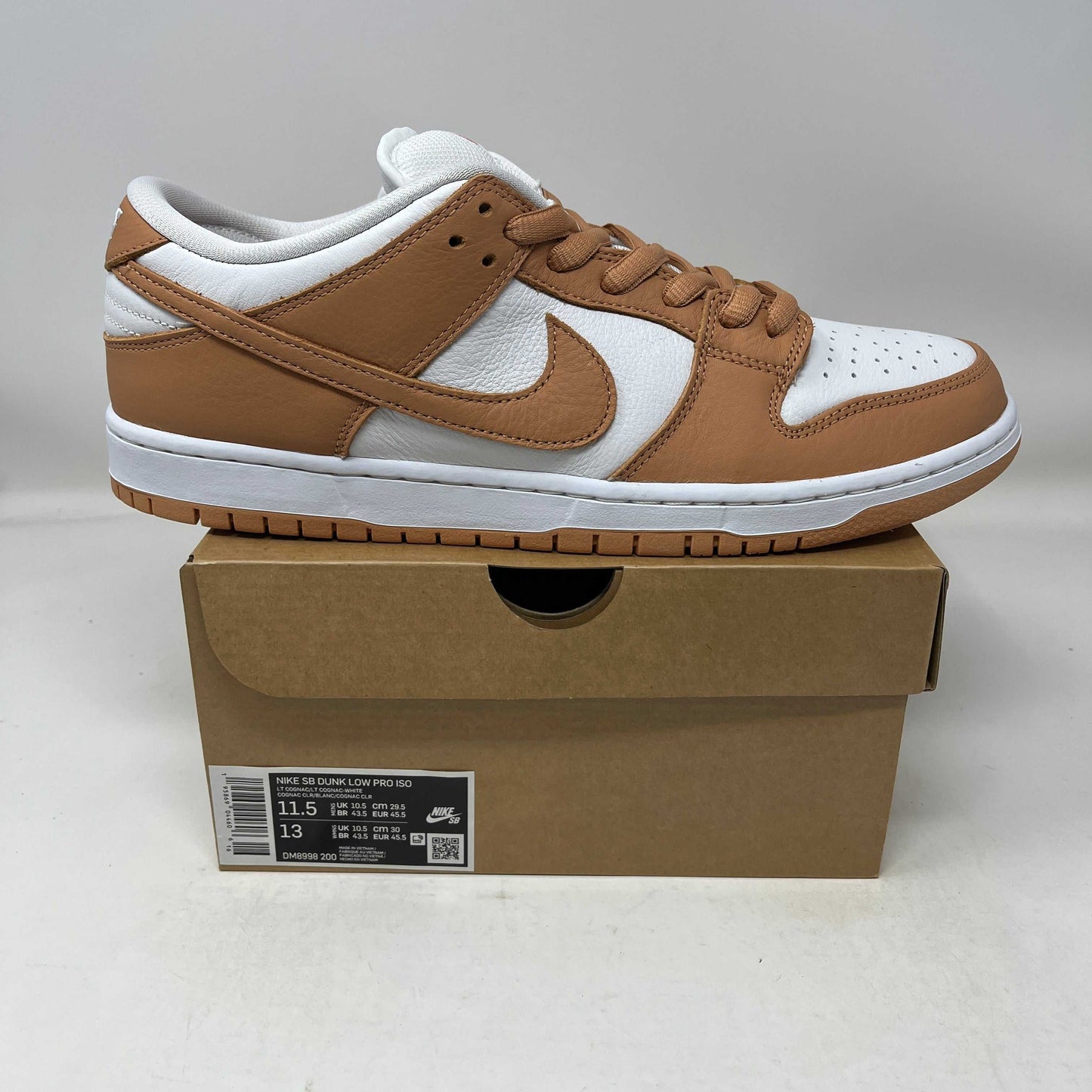 Nike SB Dunk Low Pro ISO sneaker in light cognac and white on box