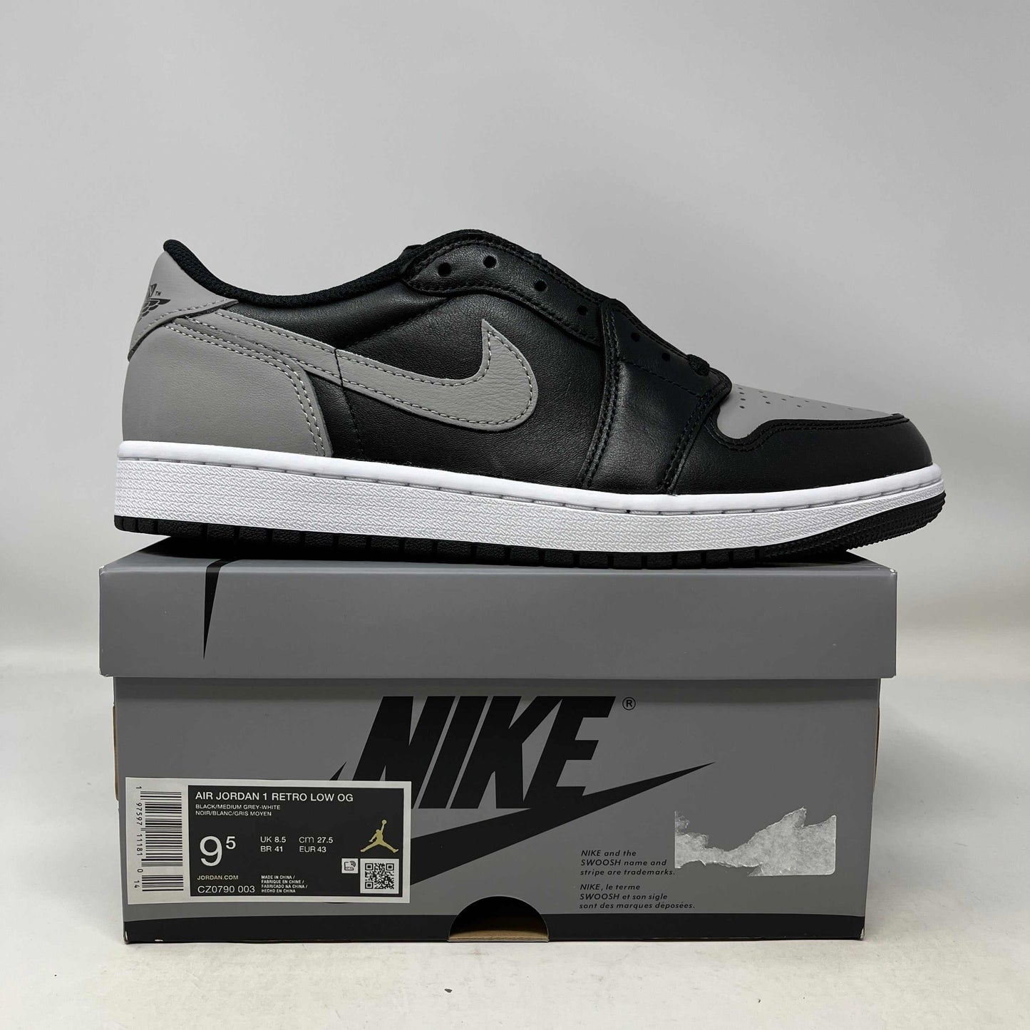 Jordan 1 Retro Low OG Shadow 2024 sneaker in black and grey on Nike box